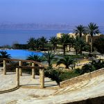 giordania, the thermal swimming pool near the spa of the hotel movenpik resort & spa with panorma on the dead sea
